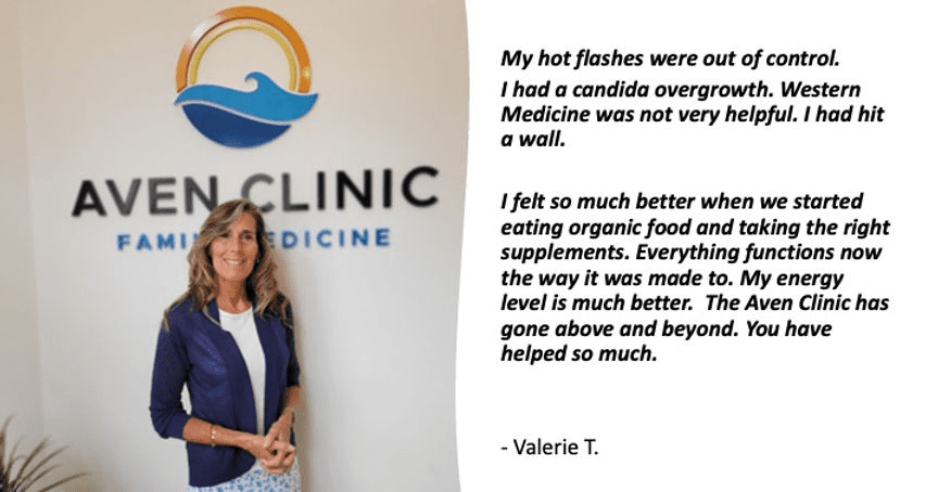 A woman standing in front of a medical sign.