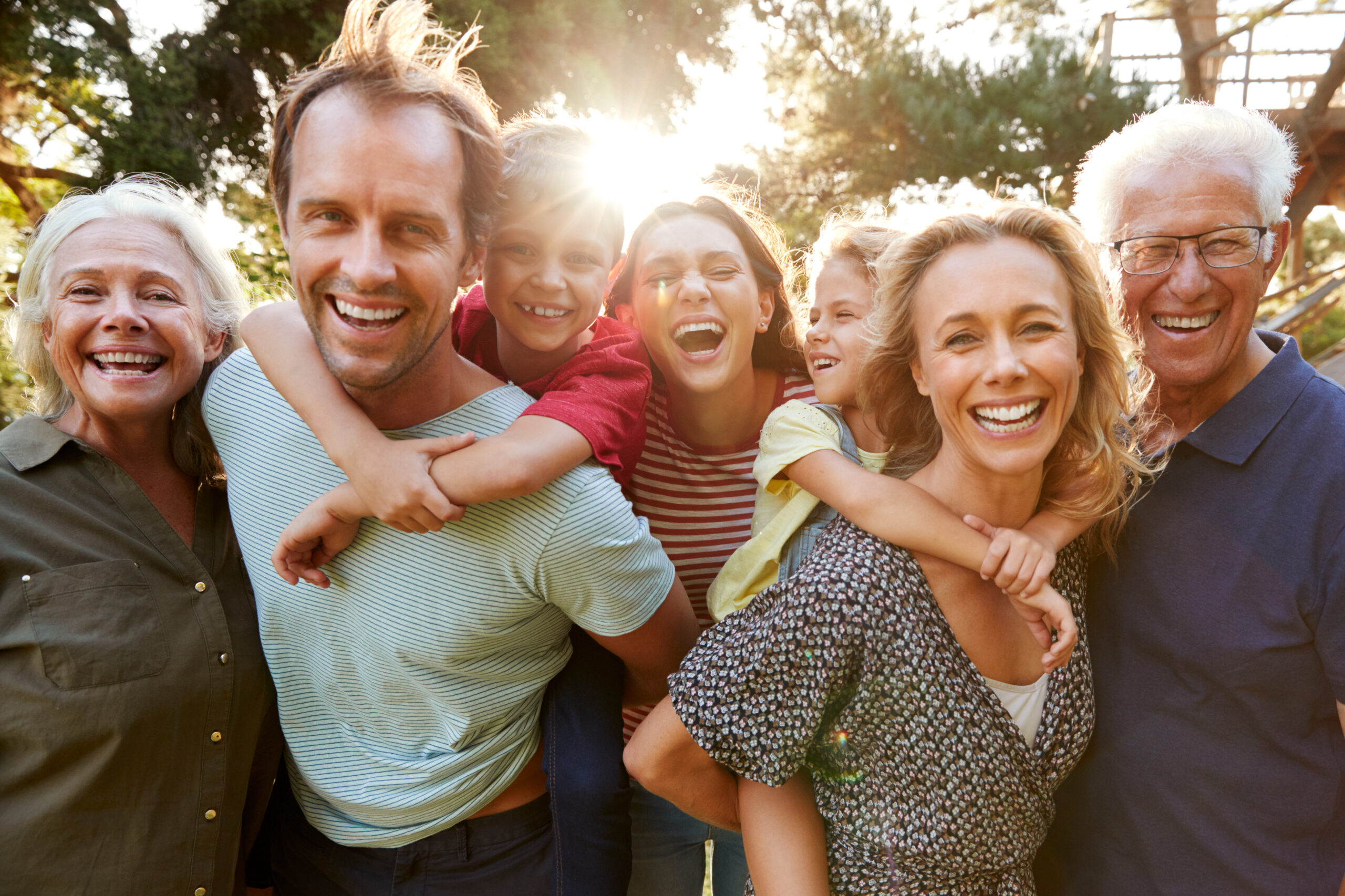 A group of people that are smiling for the camera