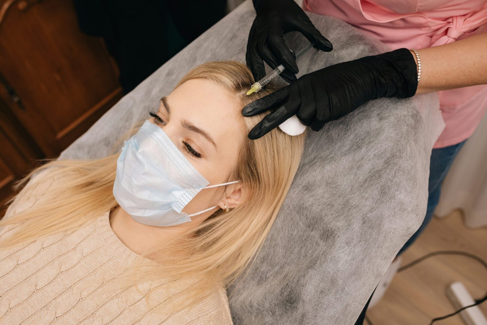 Female patient getting an injection. 